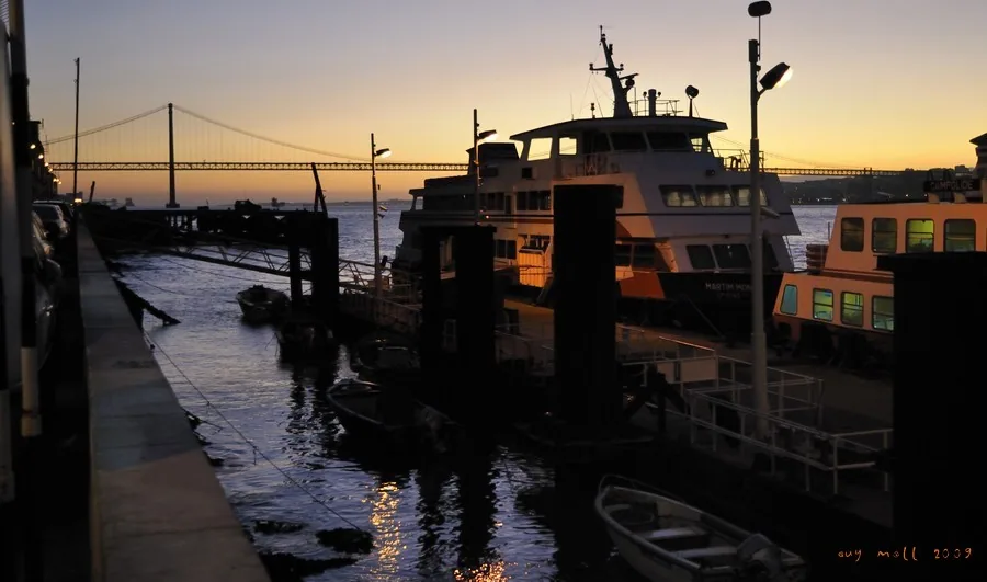 Evening by the Cacilhas ferry terminal looking towards the bridge